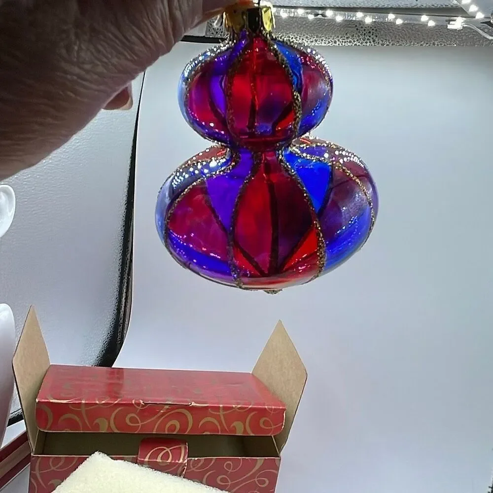 Vintage Avon 2001 Holiday Treasures blown glass ornaments.